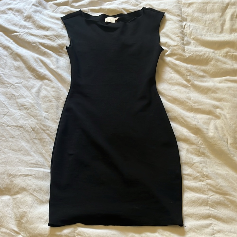 Black fitted dress with slight lettuce edge hem